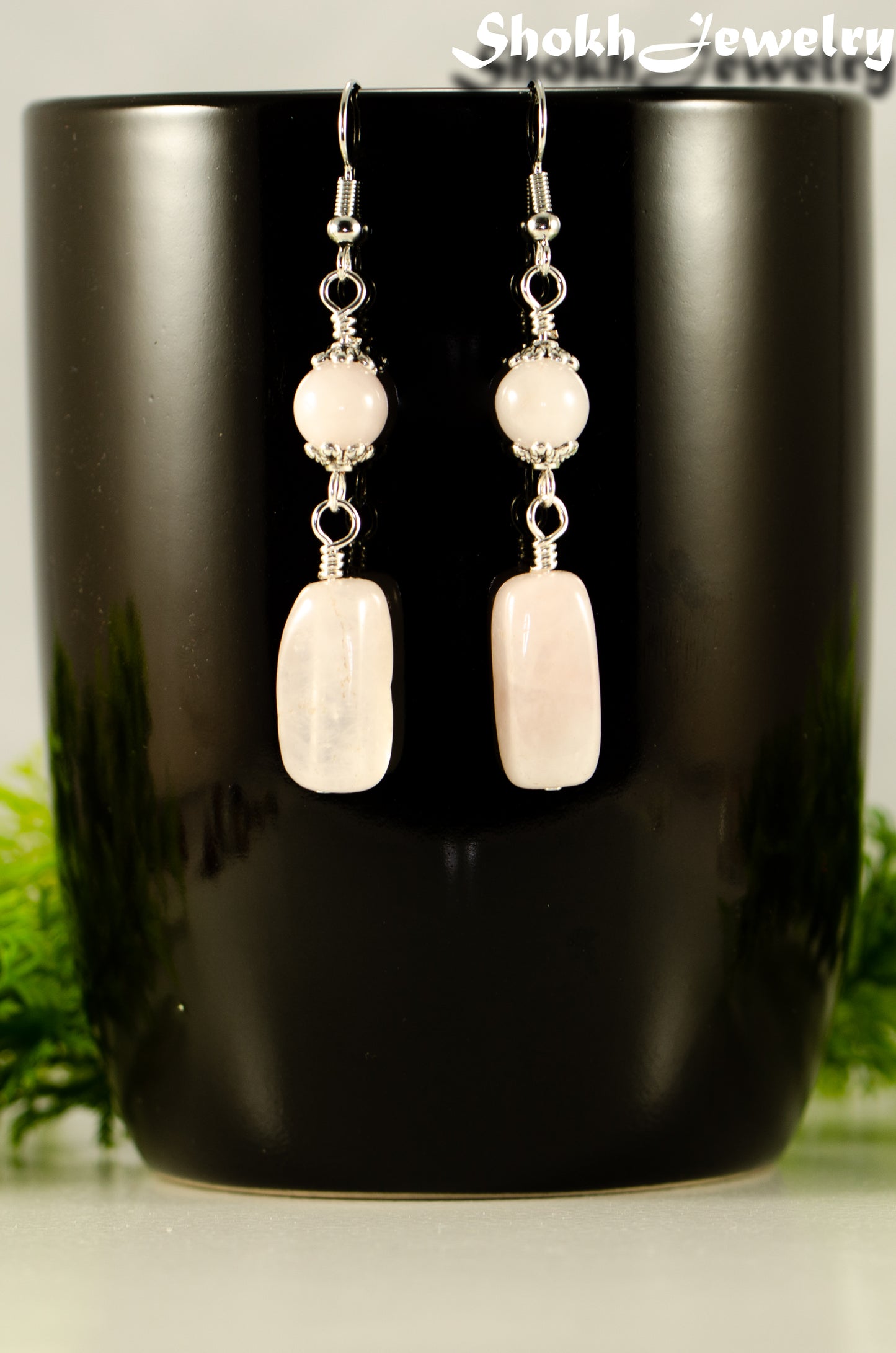 Close up of Statement Rose Quartz Crystal Earrings.