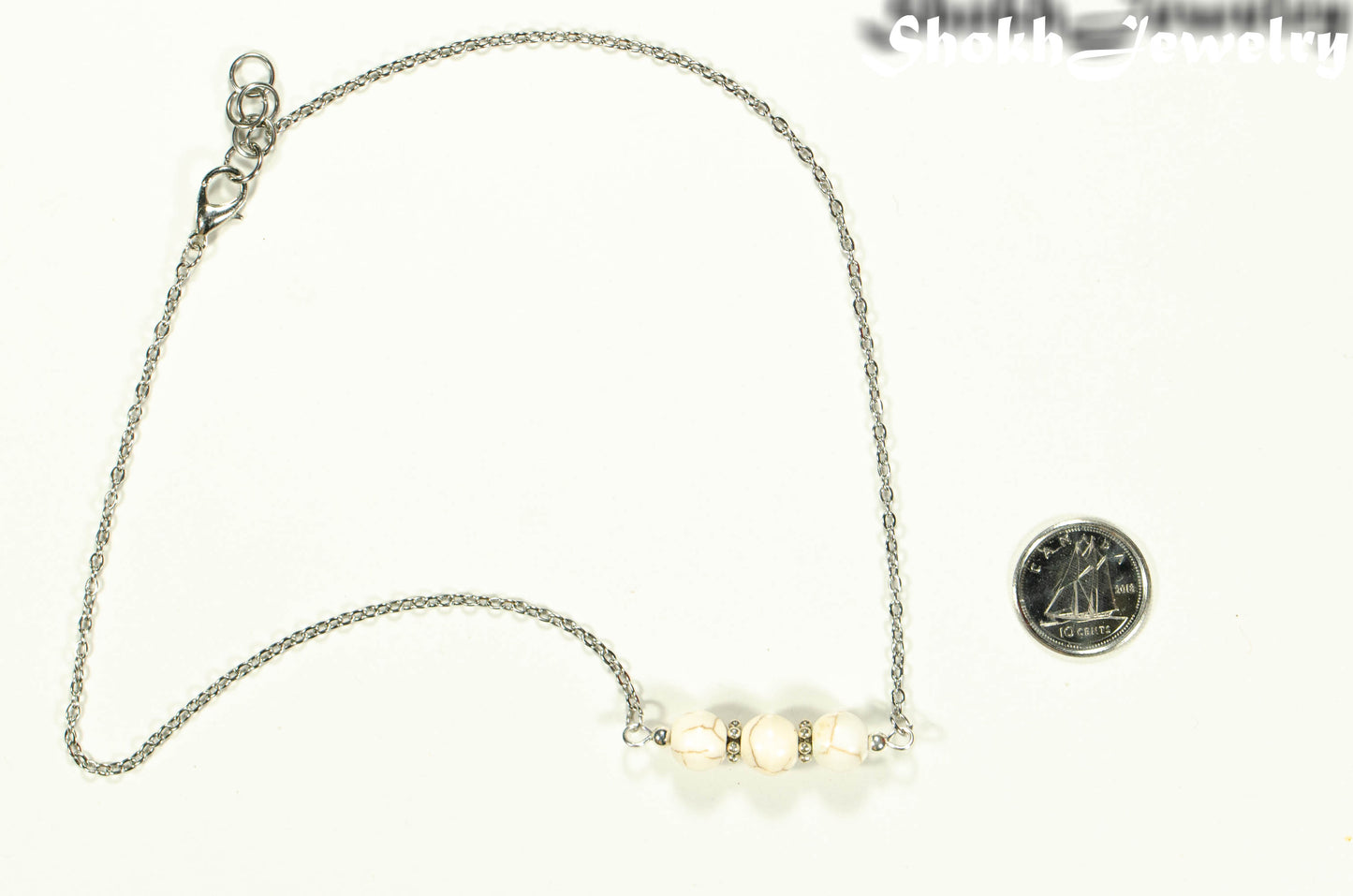 White Howlite and Dainty Chain Choker Necklace with clasp beside a dime.