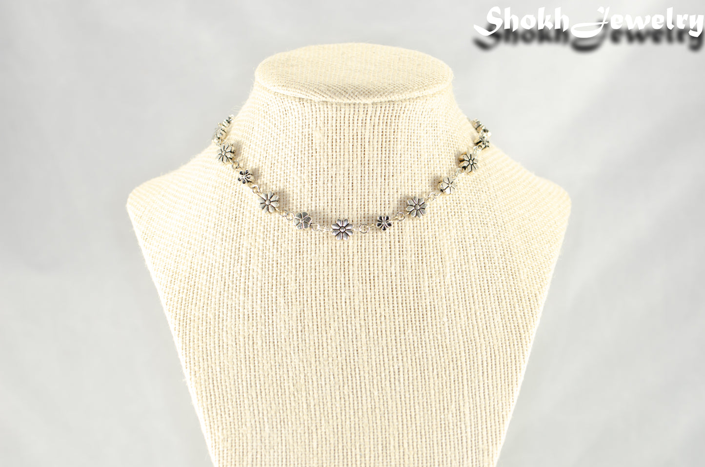 Dainty Tibetan Silver Flower Choker Necklace displayed on a bust.