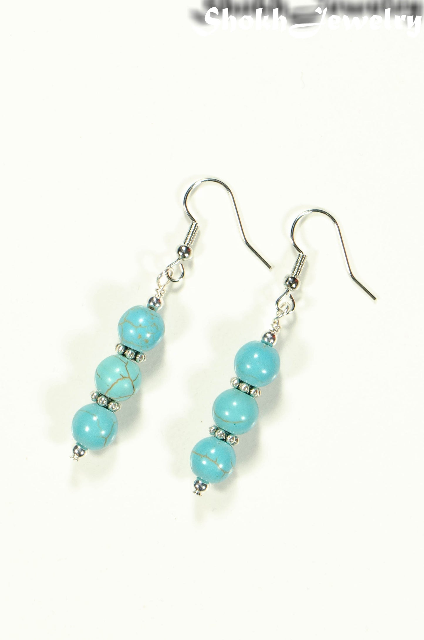 Top view of Turquoise Howlite Beaded Bar Earrings.