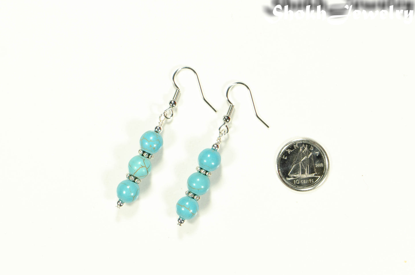 Turquoise Howlite Beaded Bar Earrings beside a dime.