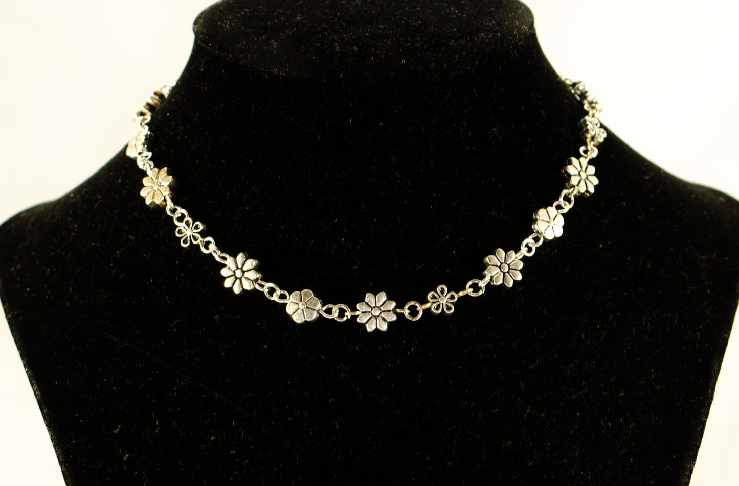 Dainty Tibetan Silver Flower Choker Necklace displayed on a bust.