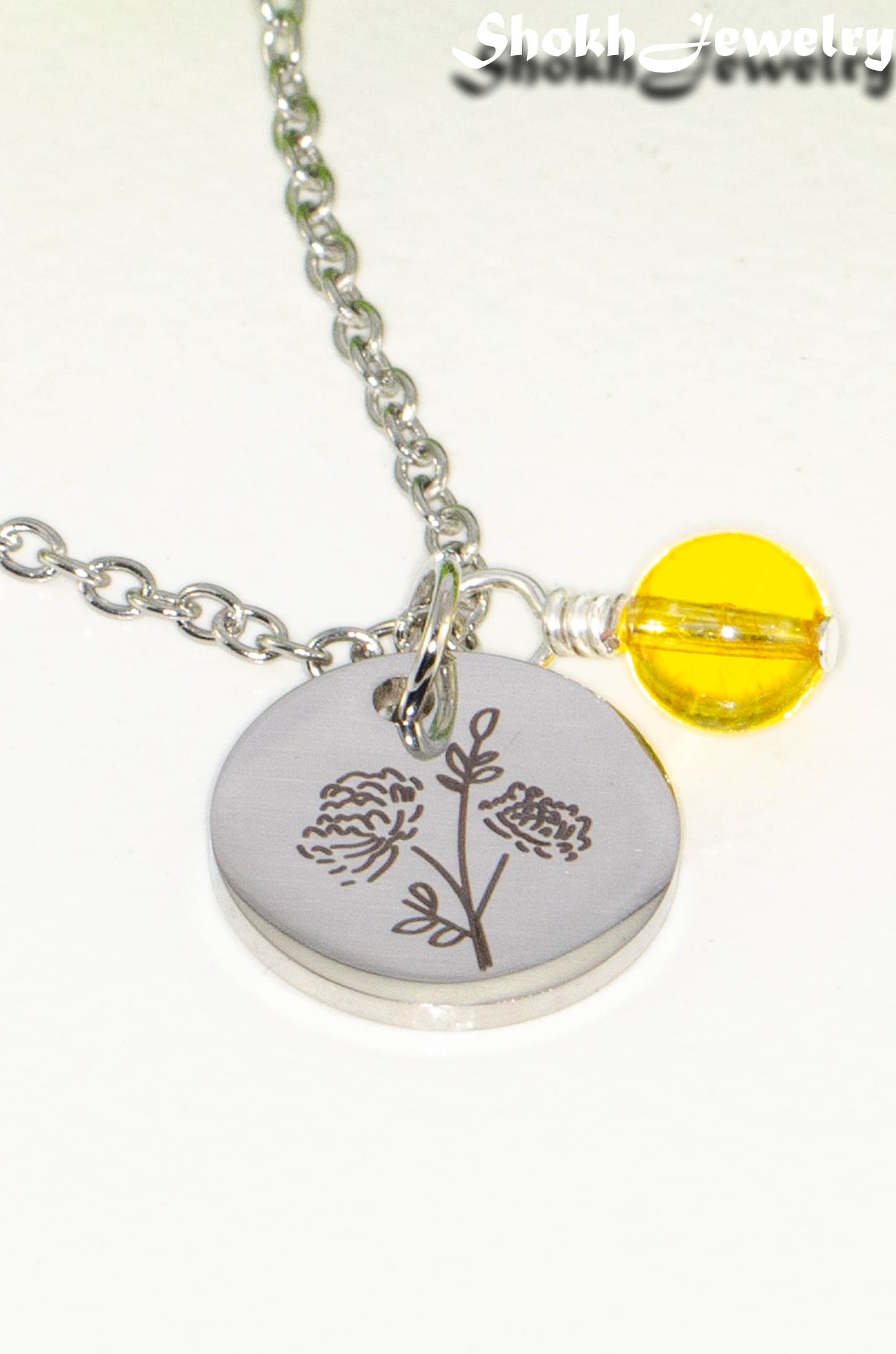 Close up of November Birth Flower Necklace with Citrine Birthstone Pendant.