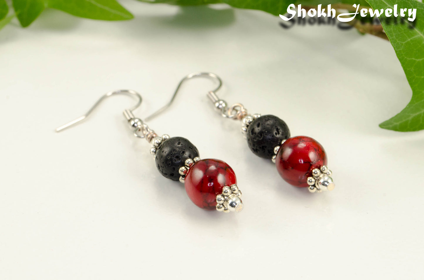 Close up of Red Quartzite and Black Lava Rock Earrings.