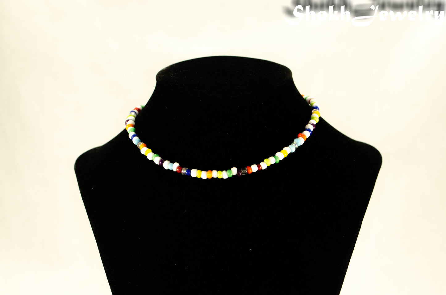 Multicolour Seed Bead Choker Necklace displayed on a bust.