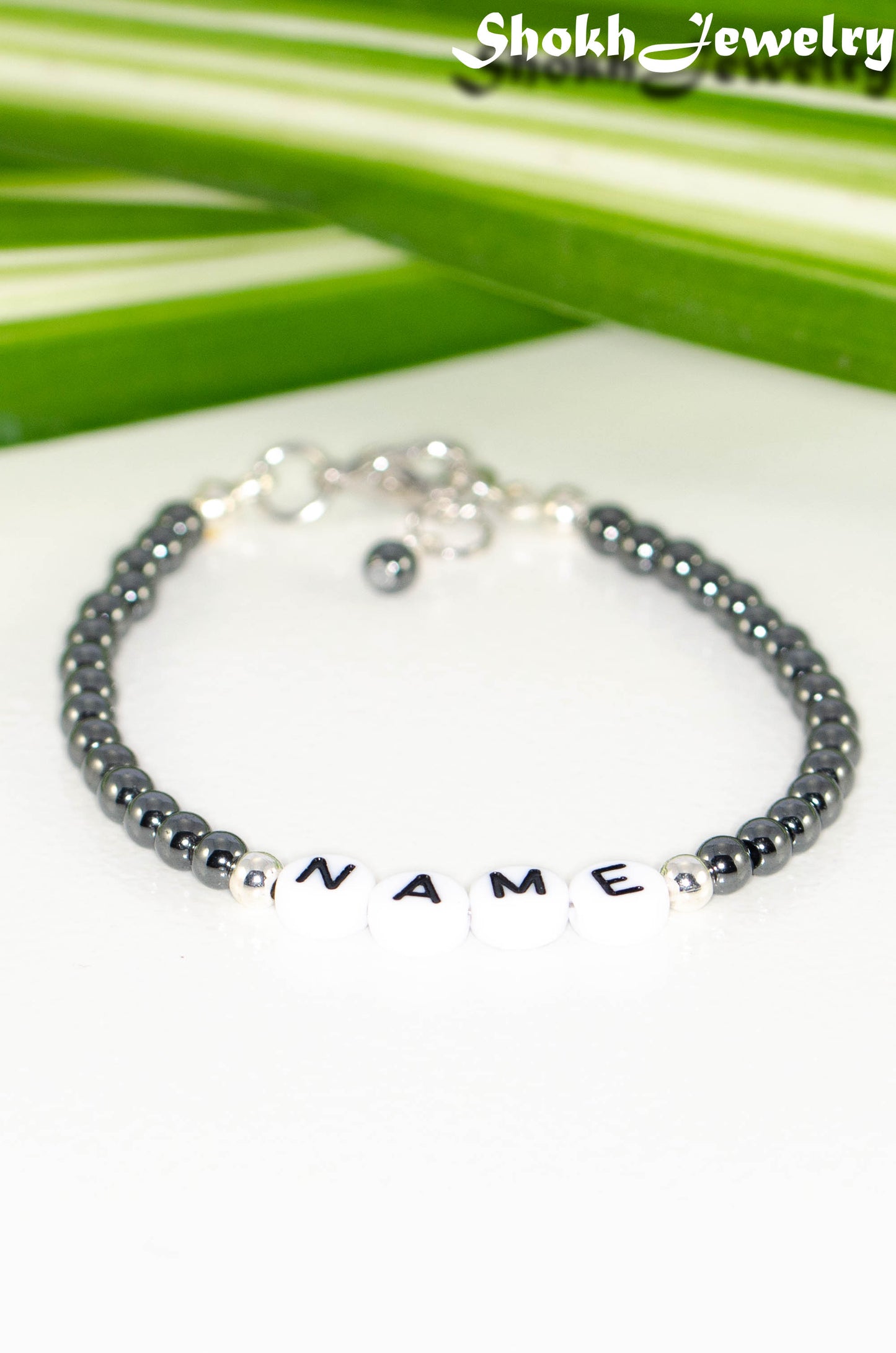 Close up of Personalized Hematite Stone Name Bracelet with Clasp.