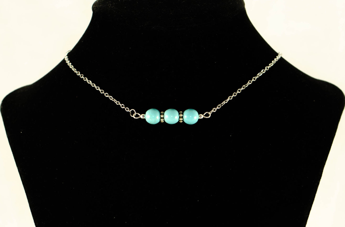 Turquoise Howlite and Dainty Chain Choker Necklace displayed on a bust.