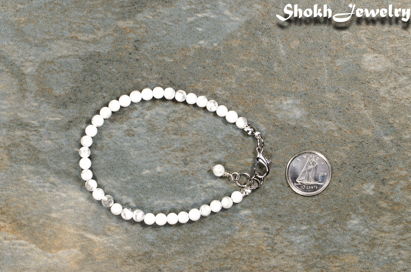4mm White Howlite anklet with Clasp beside a dime.