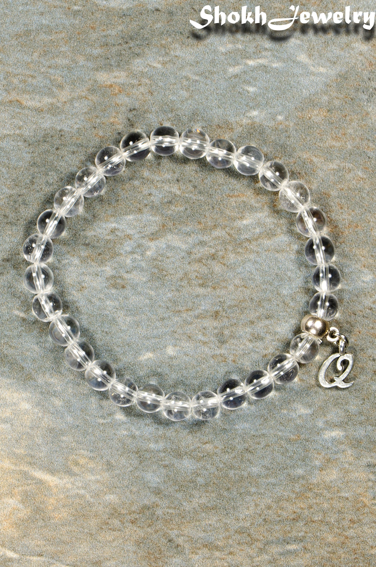 Top view of 6mm Clear Quartz Bracelet with Initial.