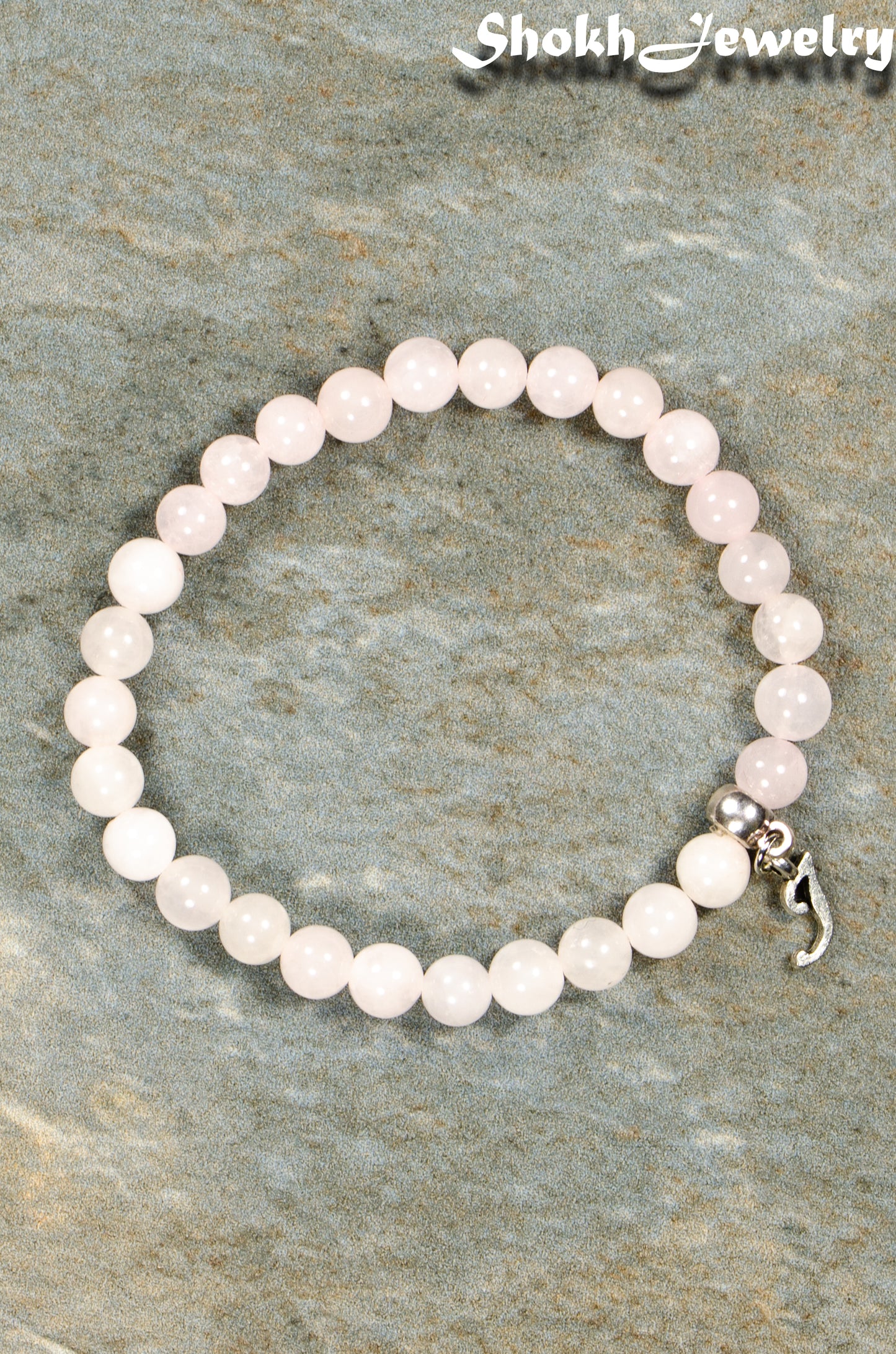 Top view of 6mm Rose Quartz Bracelet with Initial.