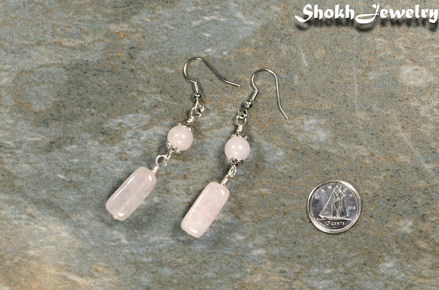 Statement Rose Quartz Crystal Earrings beside a dime.