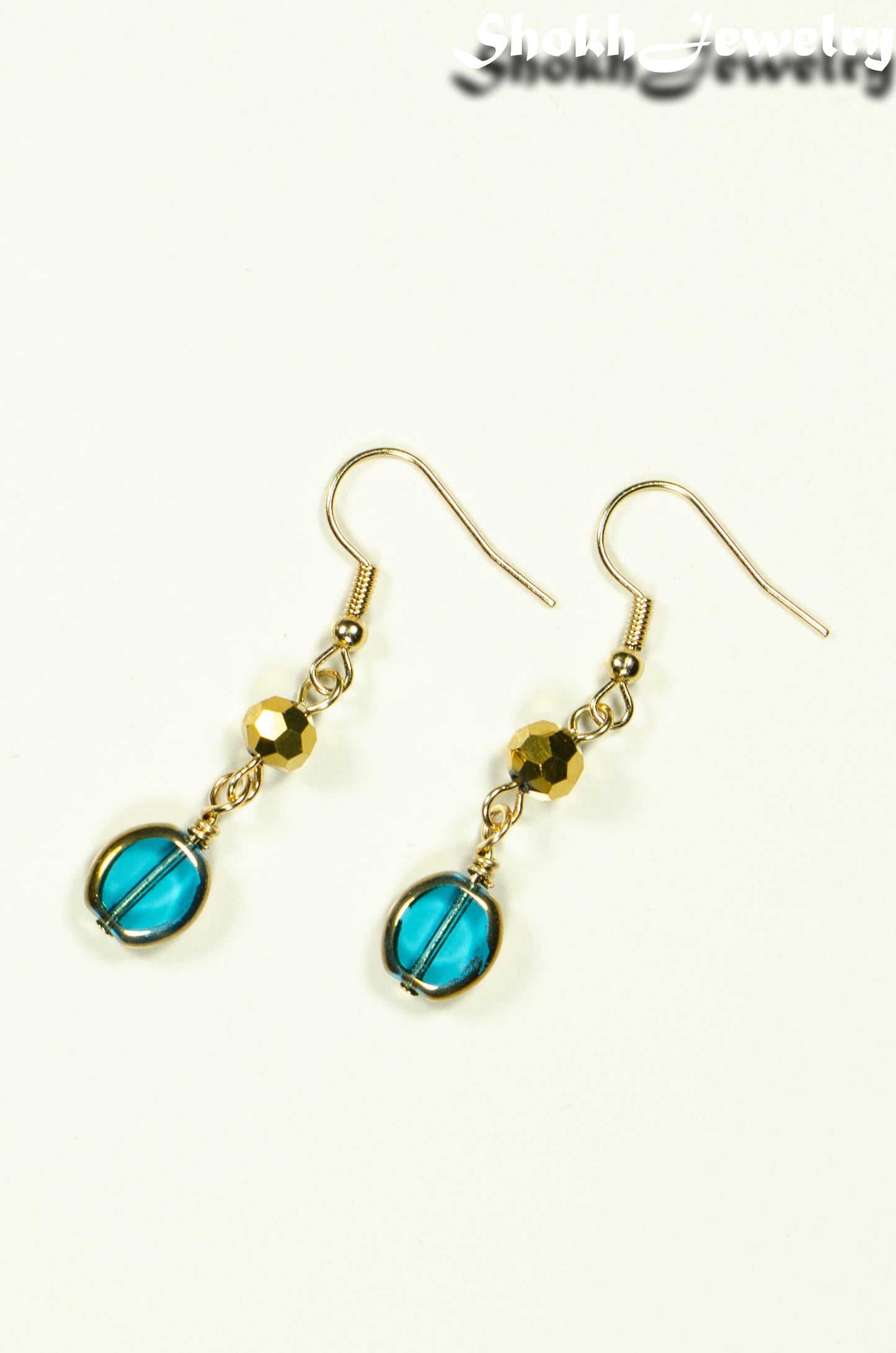 Top view of Teal and Gold Glass Bead Earrings.