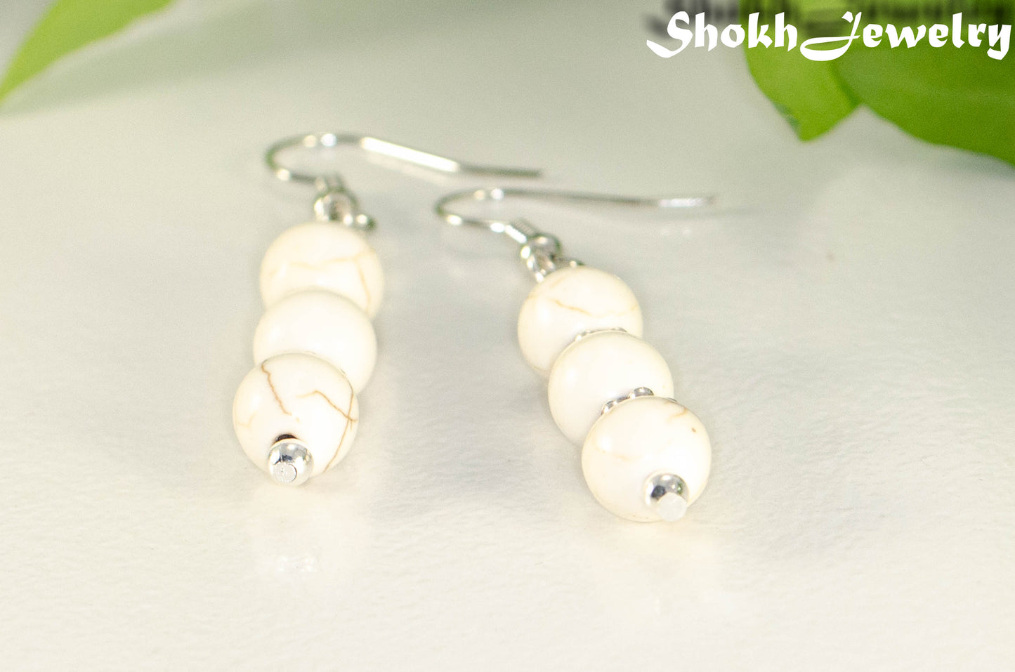 Close up of Natural White Howlite Beaded Bar Earrings.