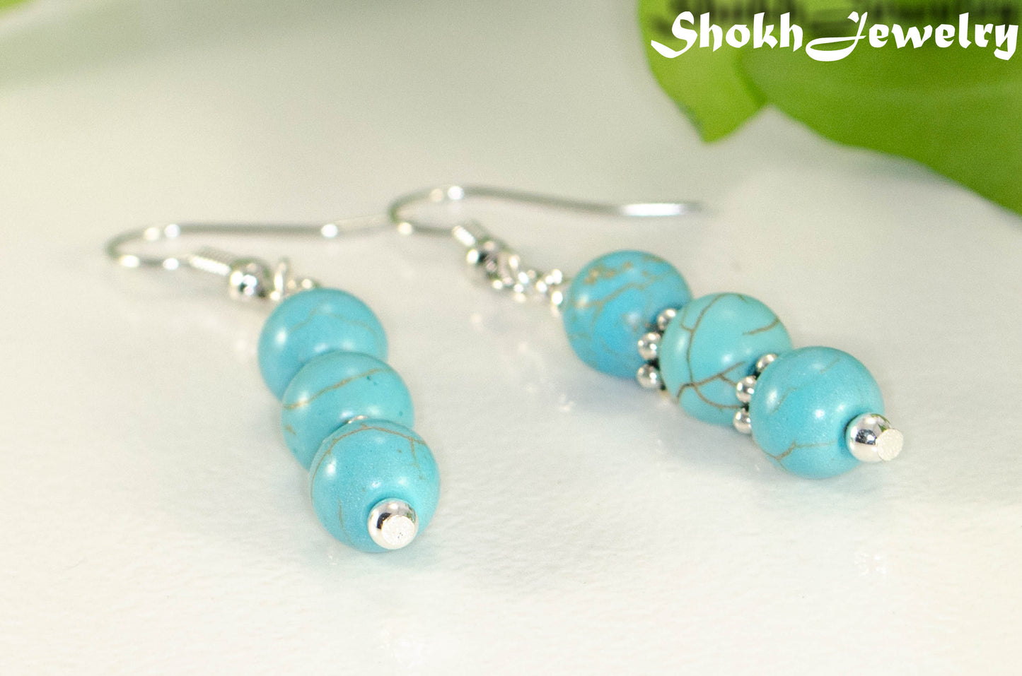 Close up of Turquoise Howlite Beaded Bar Earrings.