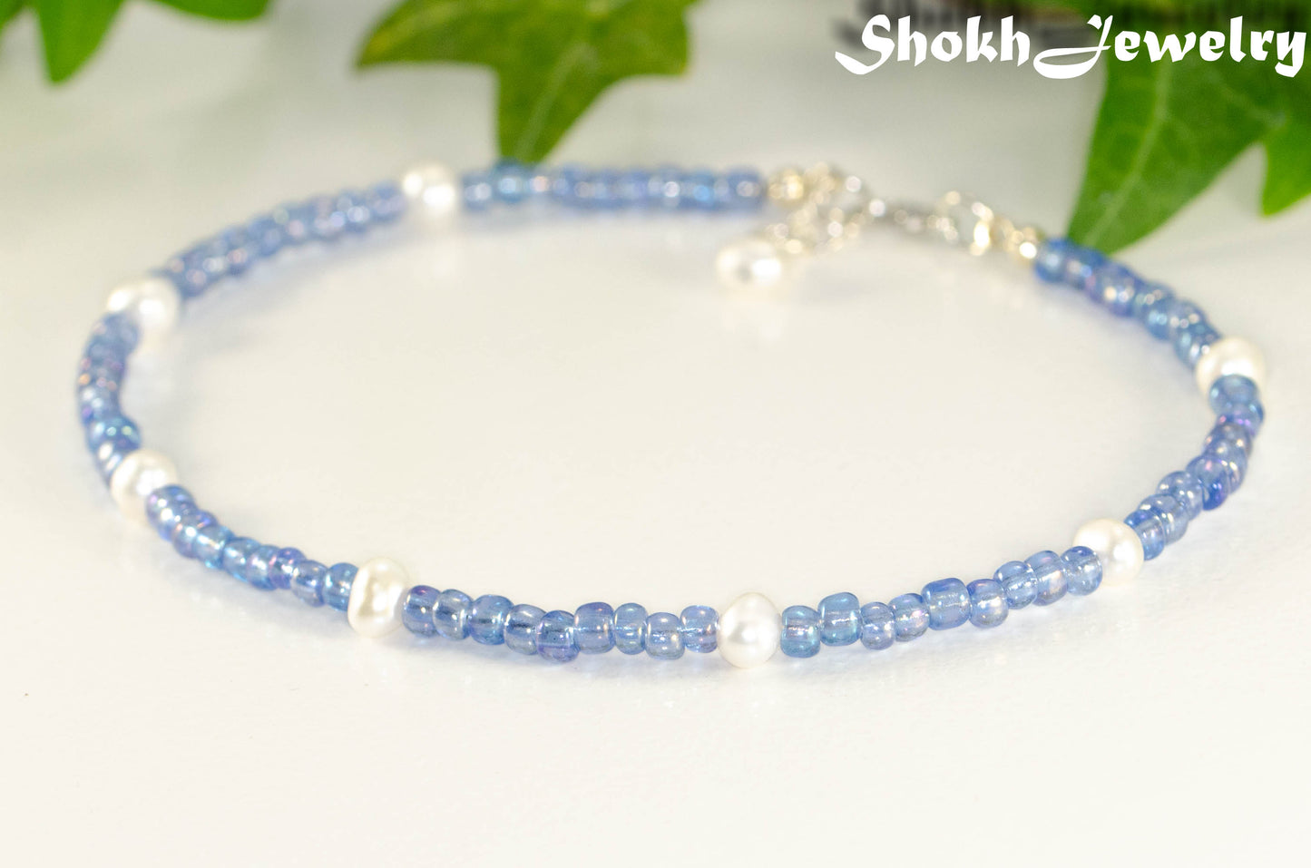 Close up of Freshwater Pearl and Blue Seed Bead Anklet.