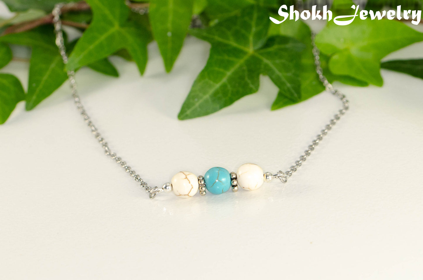 Close up of White and Turquoise Howlite and Dainty Chain Choker Necklace.
