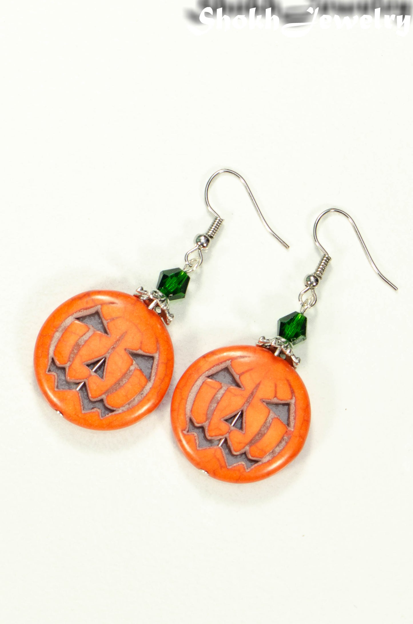 Top view of Spooky Halloween Pumpkin Earrings.