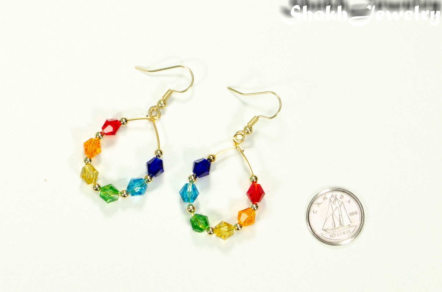 Rainbow Glass Crystal Hoop Earrings beside a dime.