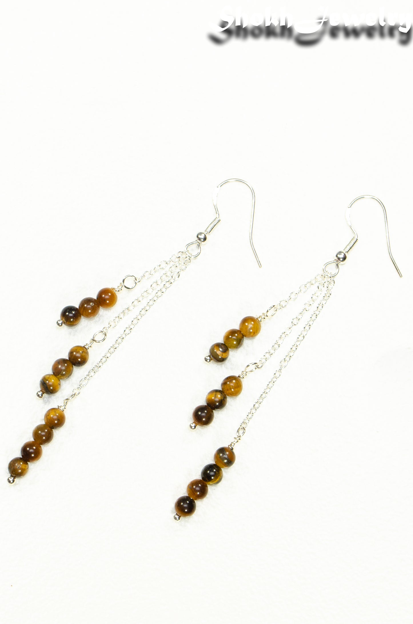 Top view of Silver Plated Chain and Tiger's Eye Stone Earrings.