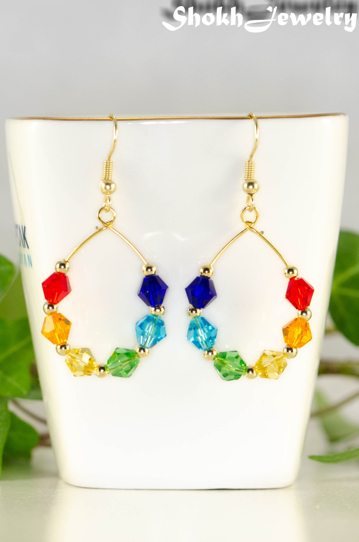 Close up of Rainbow Glass Crystal Hoop Earrings.