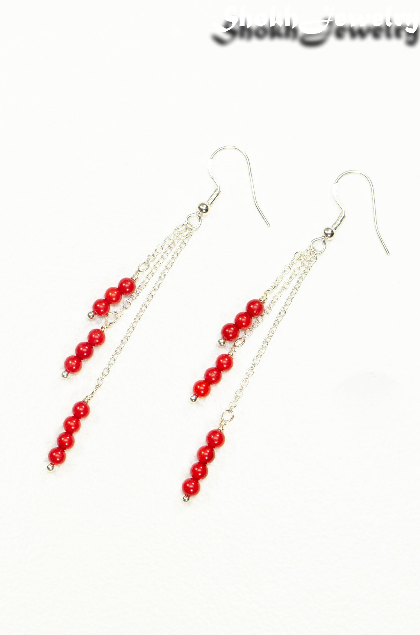 Top view of Silver Plated Chain and Red Coral Earrings.