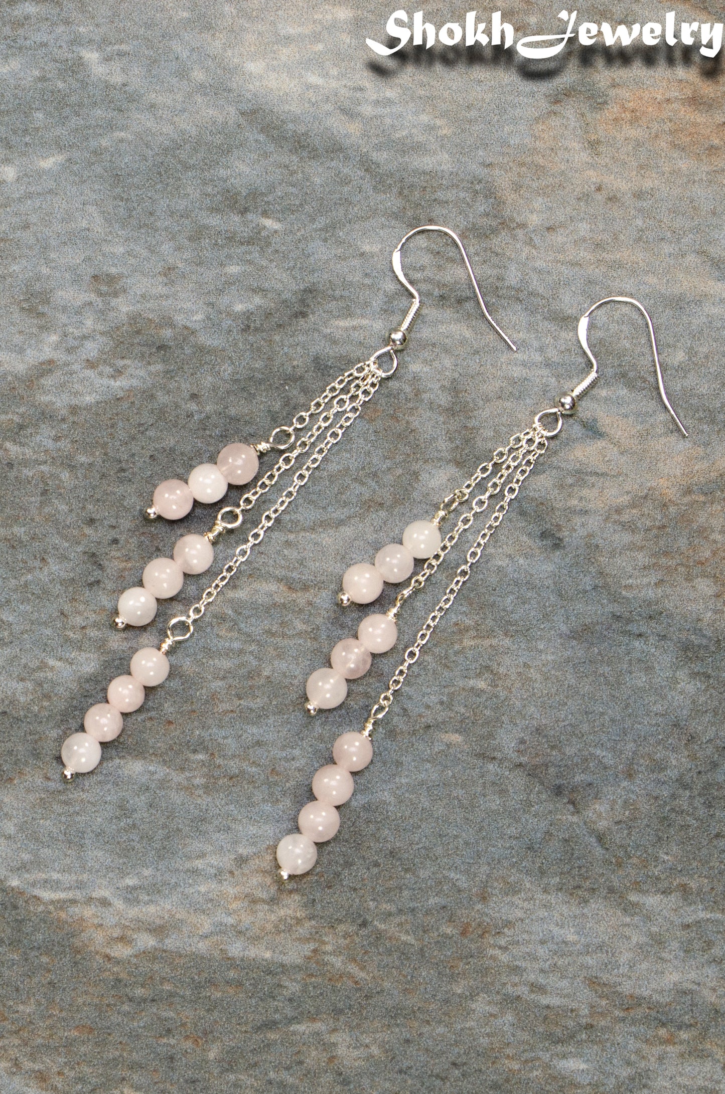 Top view of Silver Plated Chain and Rose Quartz Crystal Earrings.