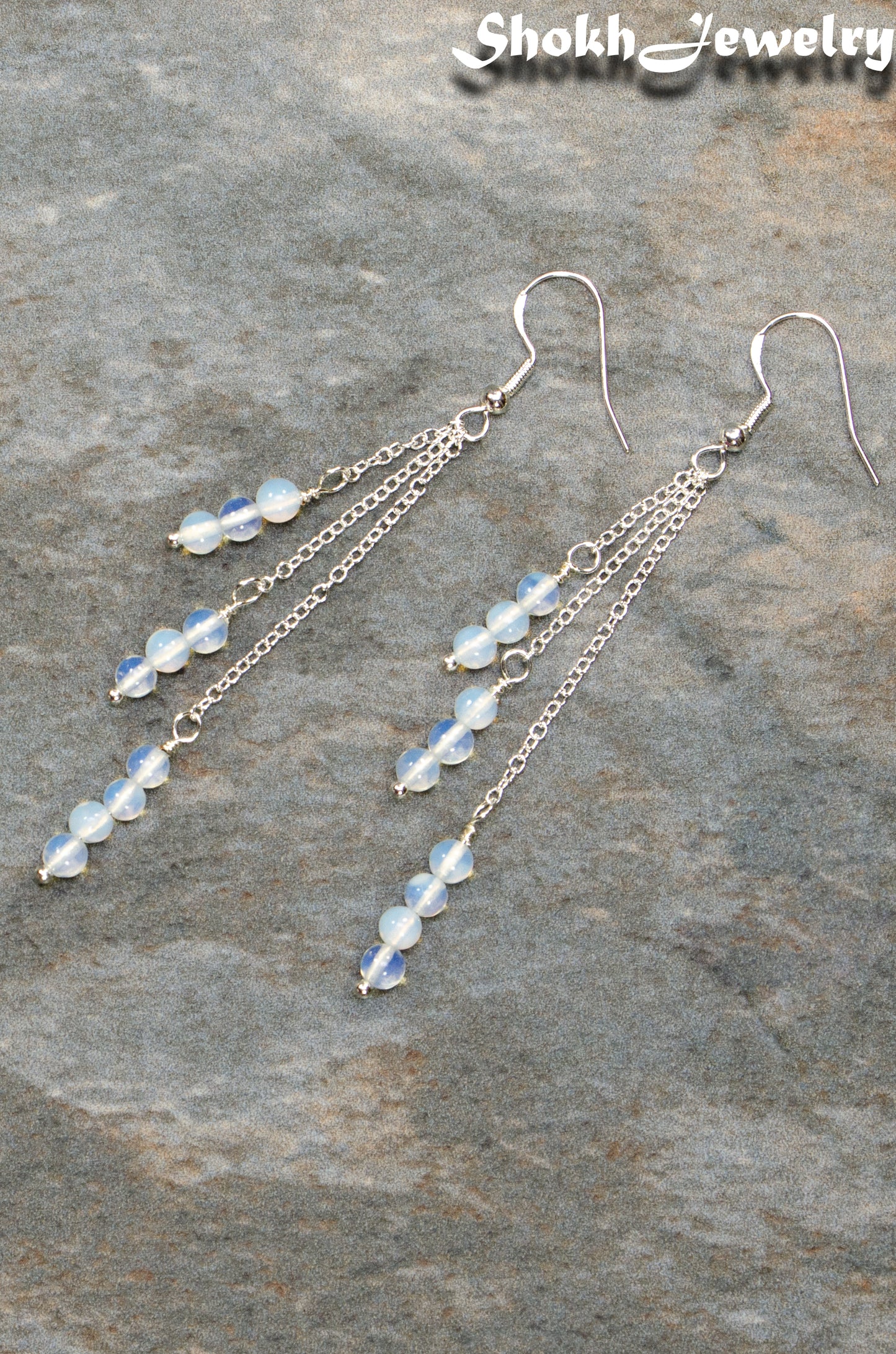 Top view of Silver Plated Chain and White Opal Crystal Earrings.
