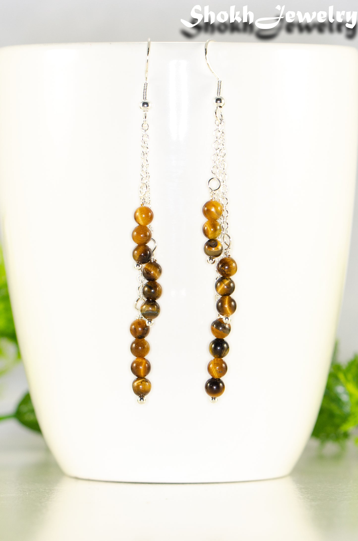 Close up of Silver Plated Chain and Tiger's Eye Stone Earrings.