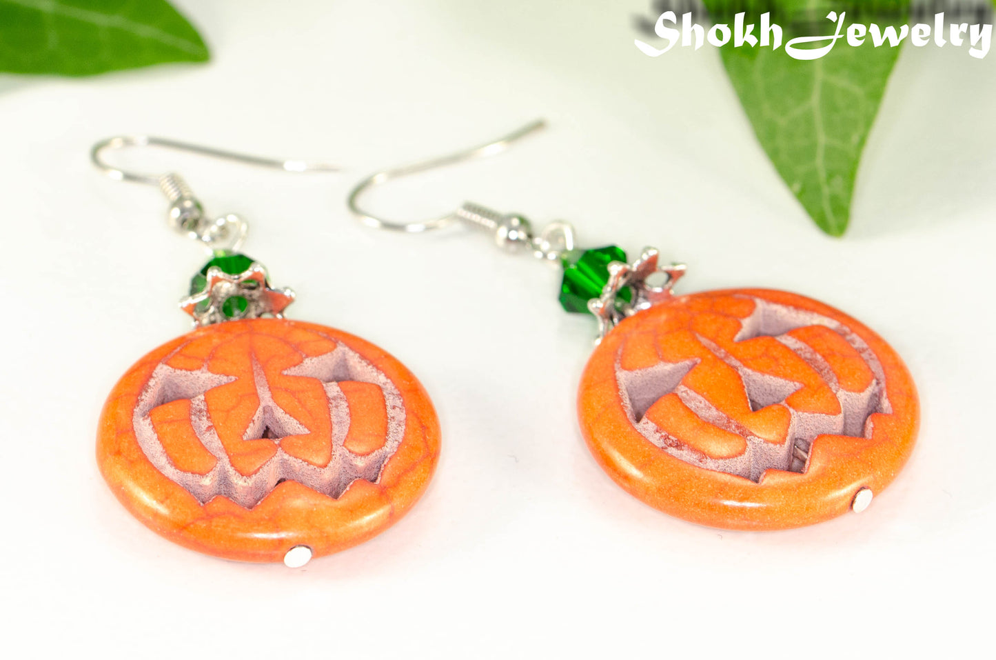 Close up of Spooky Halloween Pumpkin Earrings.
