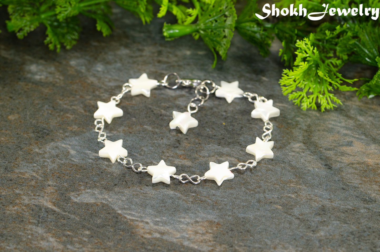 Natural Seashell Star Link Bracelet with lobster claw clasp and a dangling star.