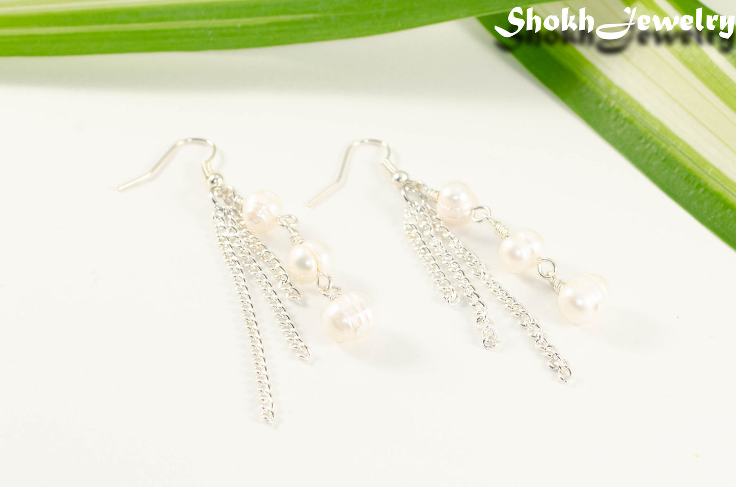 Long Chain and Freshwater Pearls Earrings.