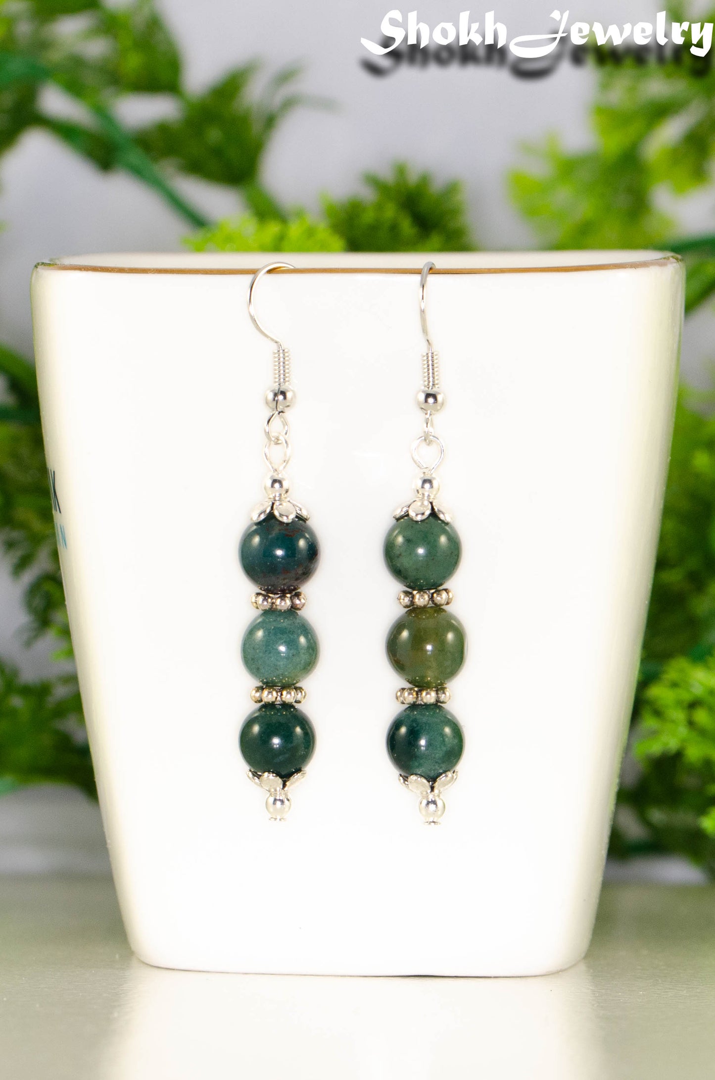 Close up of Natural Moss Agate Beaded Bar Earrings.