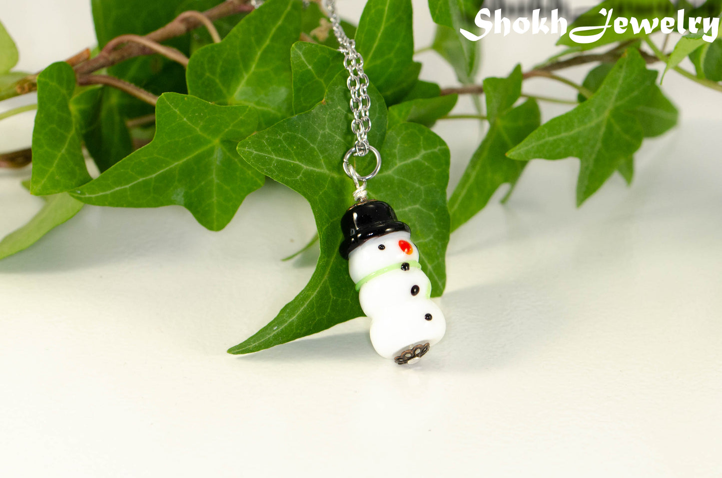 Close up of Glass Bead Snowman Pendant Necklace.