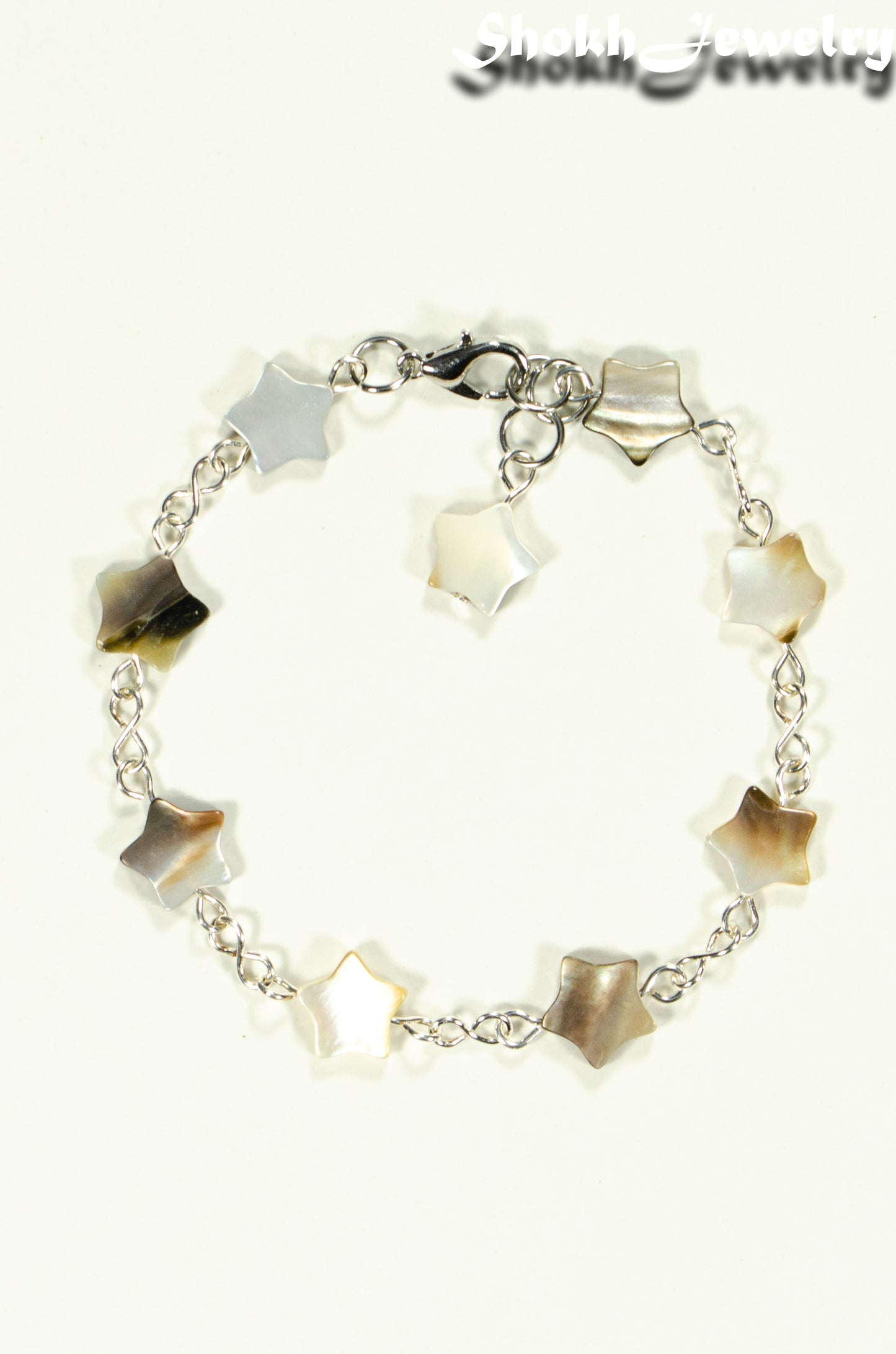 Top view of Natural Gray Seashell Star Link Bracelet.