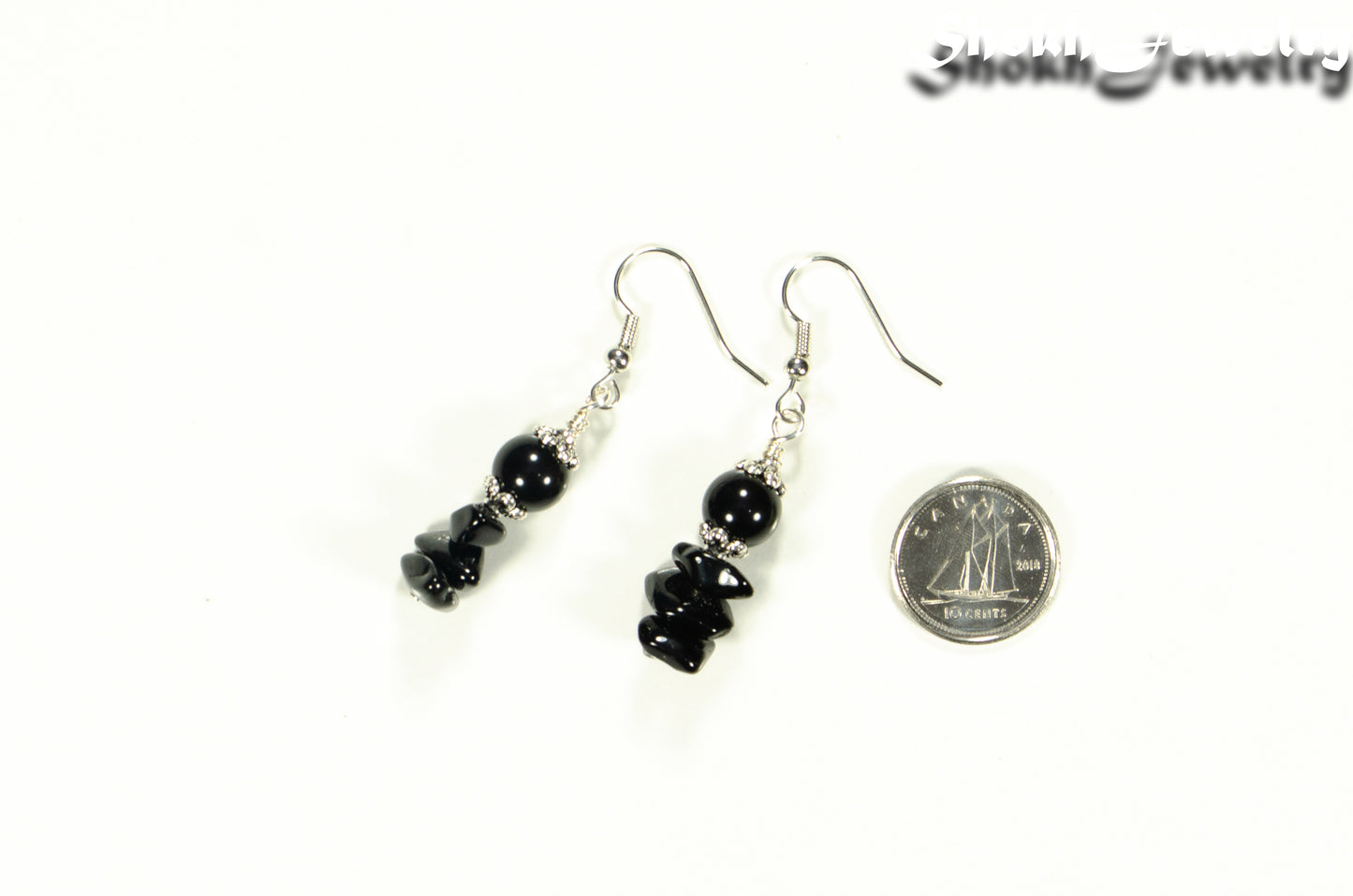 Simple Black Obsidian Crystal Chip Earrings beside a dime.