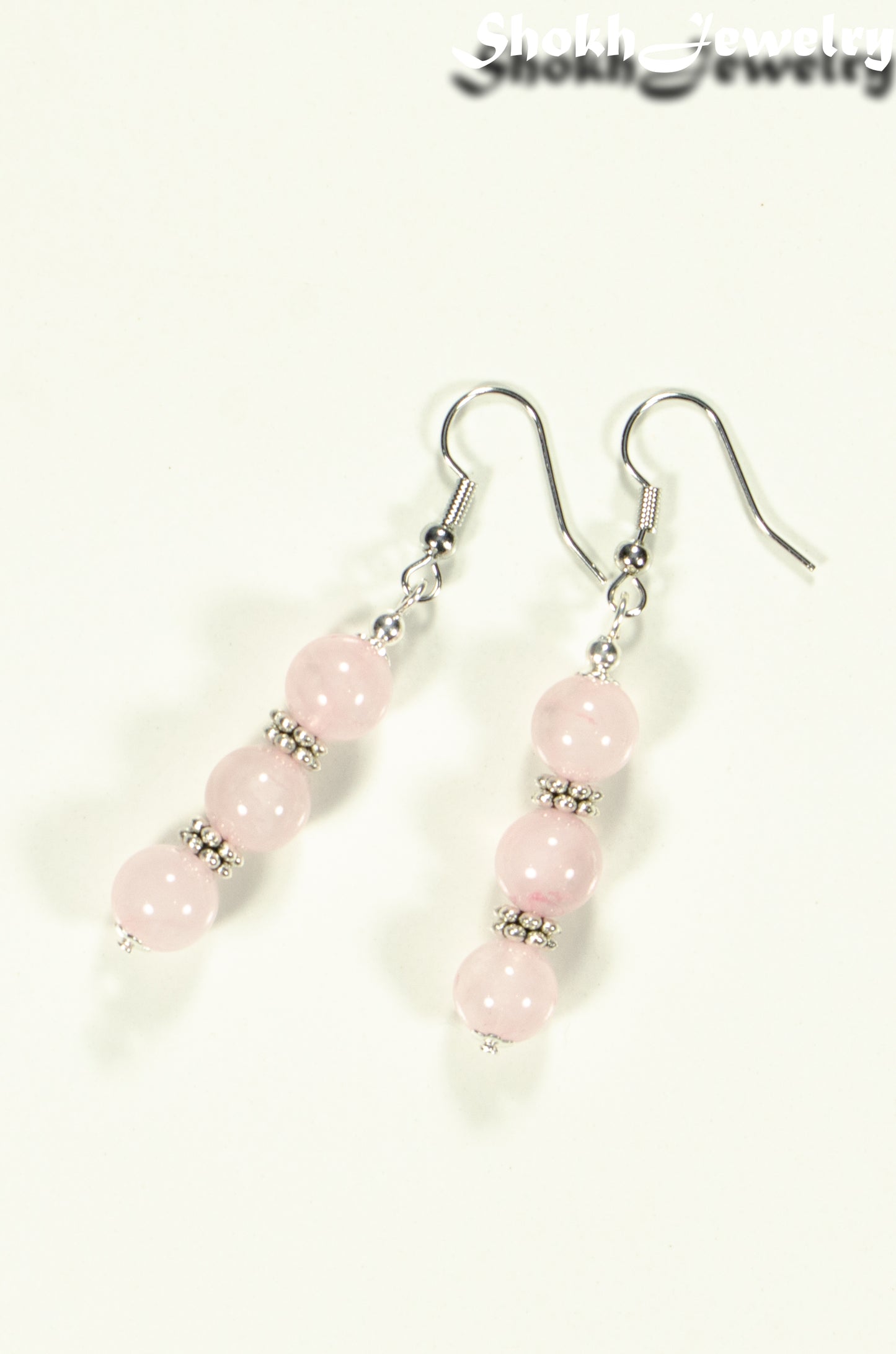 Top view of Natural Rose Quartz Beaded Bar Earrings.