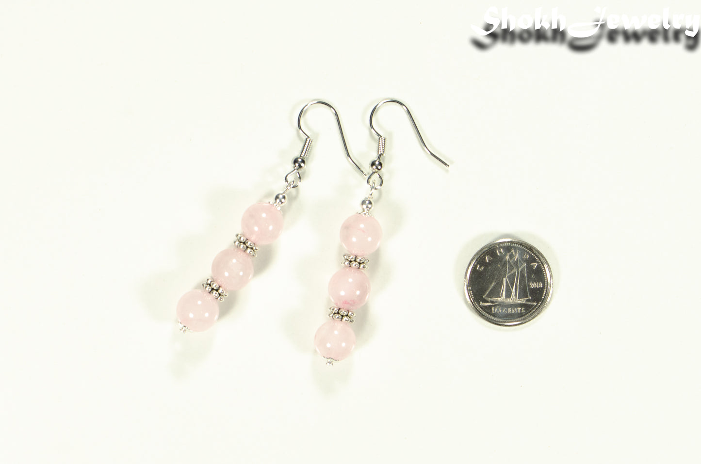 Natural Rose Quartz Beaded Bar Earrings beside a dime.