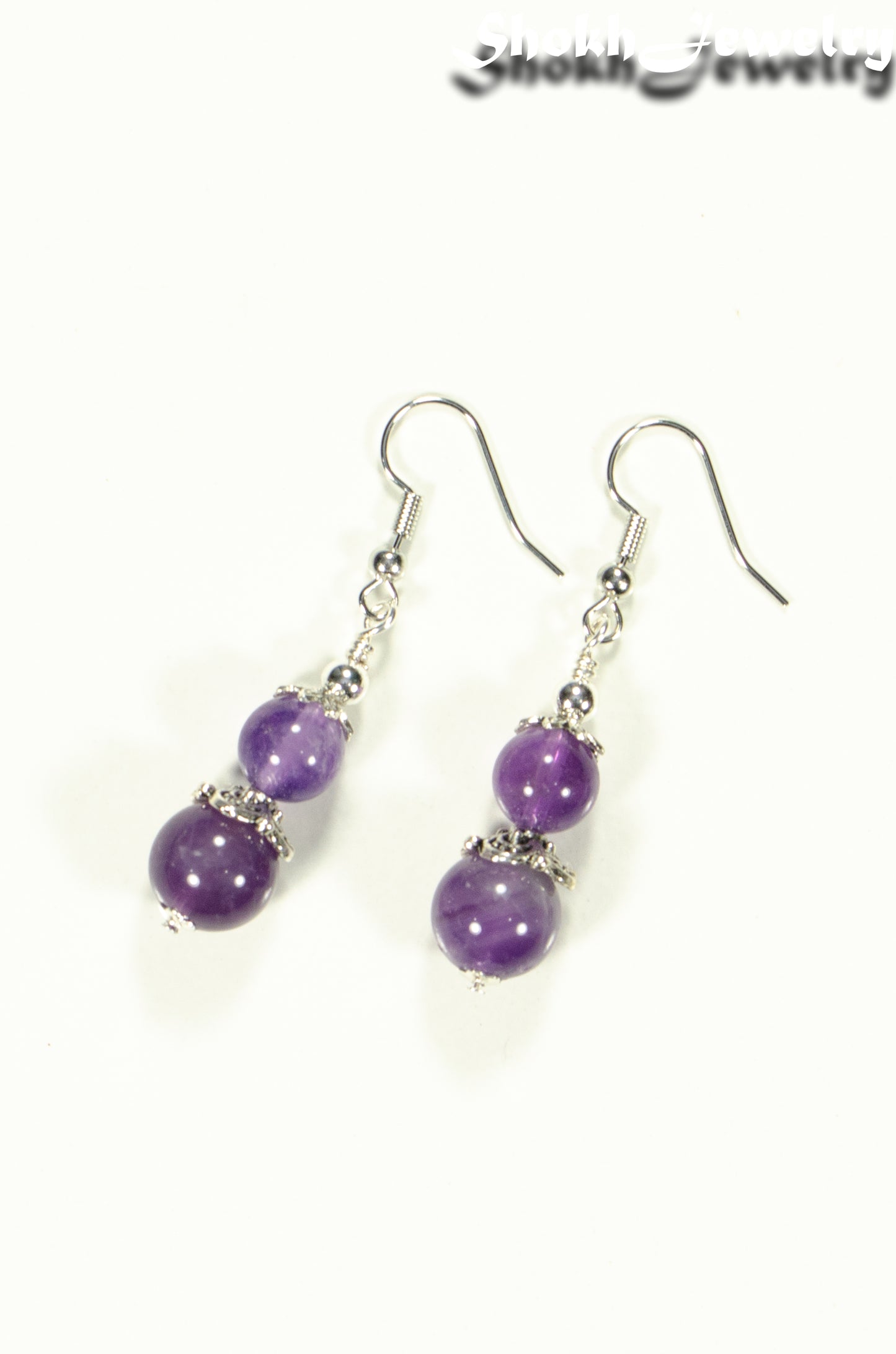Top view of Natural Amethyst Dangle Earrings.