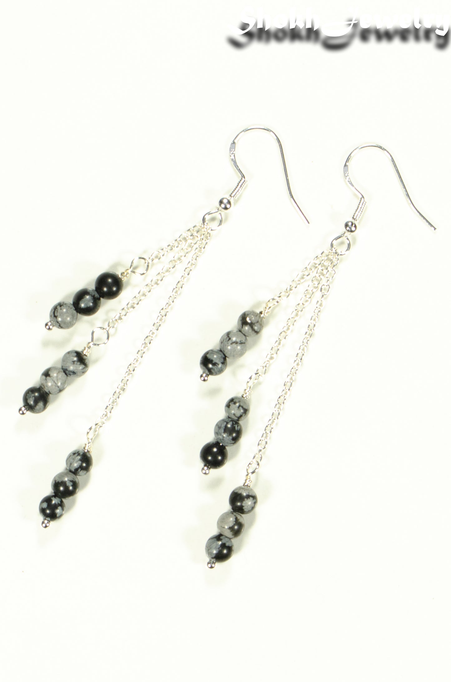 Top view of Silver Plated Chain and Snowflake Obsidian Stone Earrings