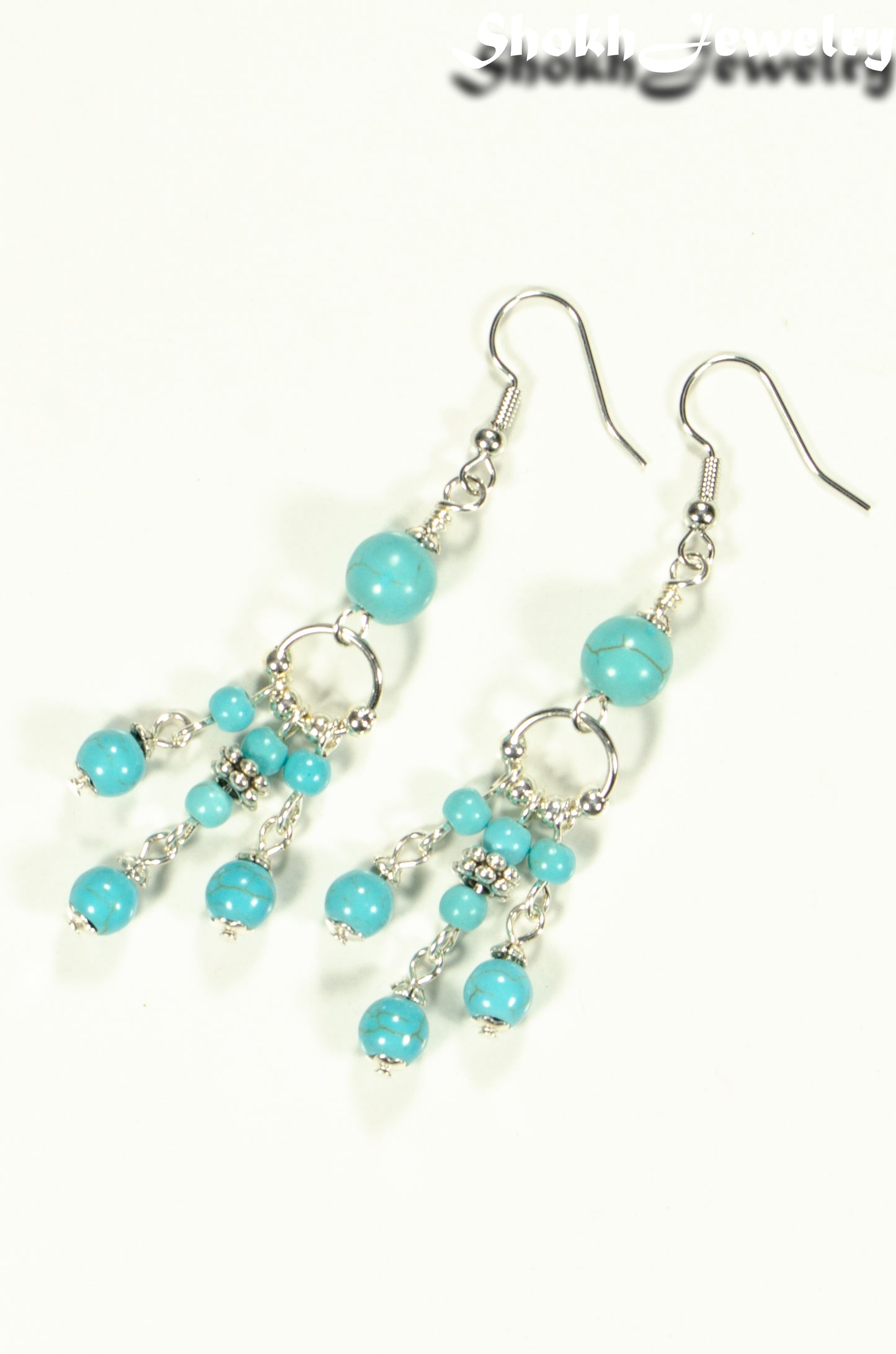 Top view of Statement Turquoise Howlite Chandelier Earrings.