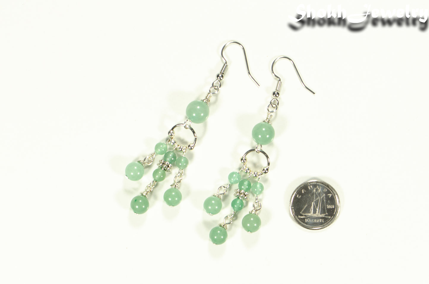 Statement Green Aventurine Crystal Chandelier Earrings beside a dime.