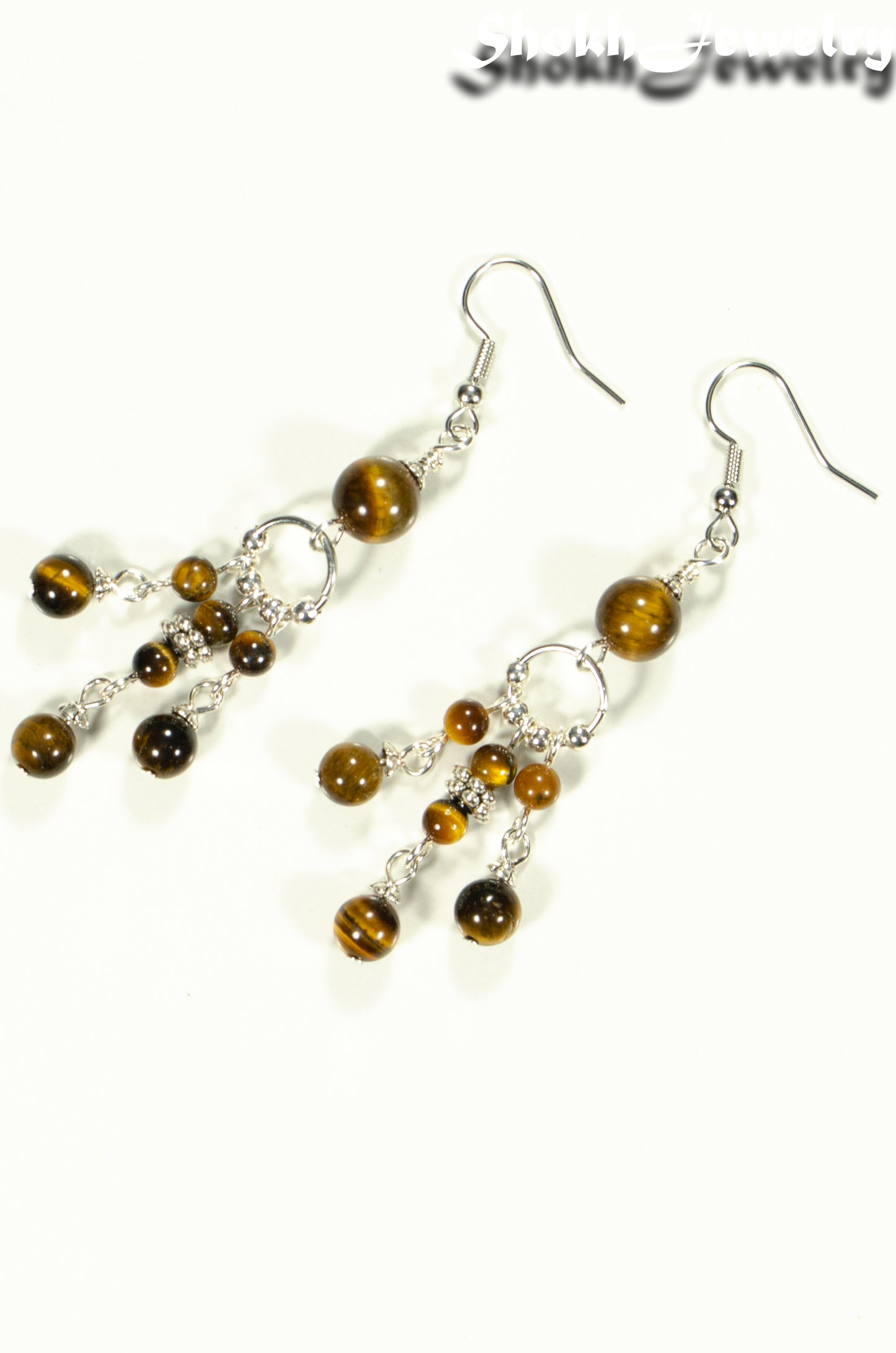 Top view of Statement Tiger's Eye Chandelier Earrings.