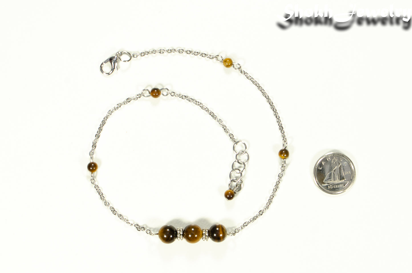 Natural Tiger's Eye and Chain Choker Necklace beside a dime.