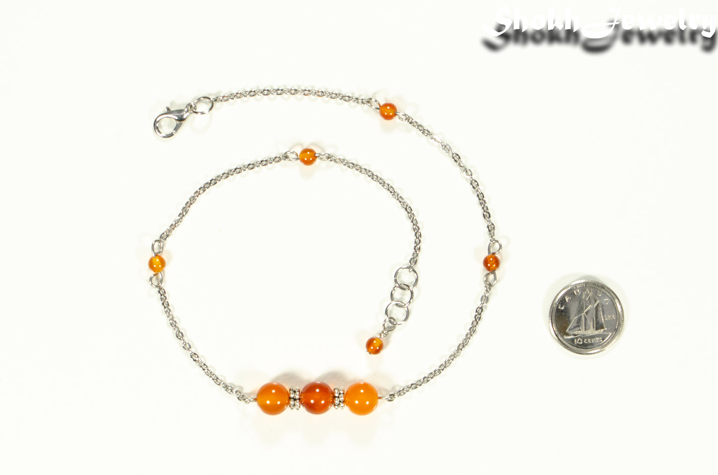 Natural Carnelian and Chain Choker Necklace beside a dime.
