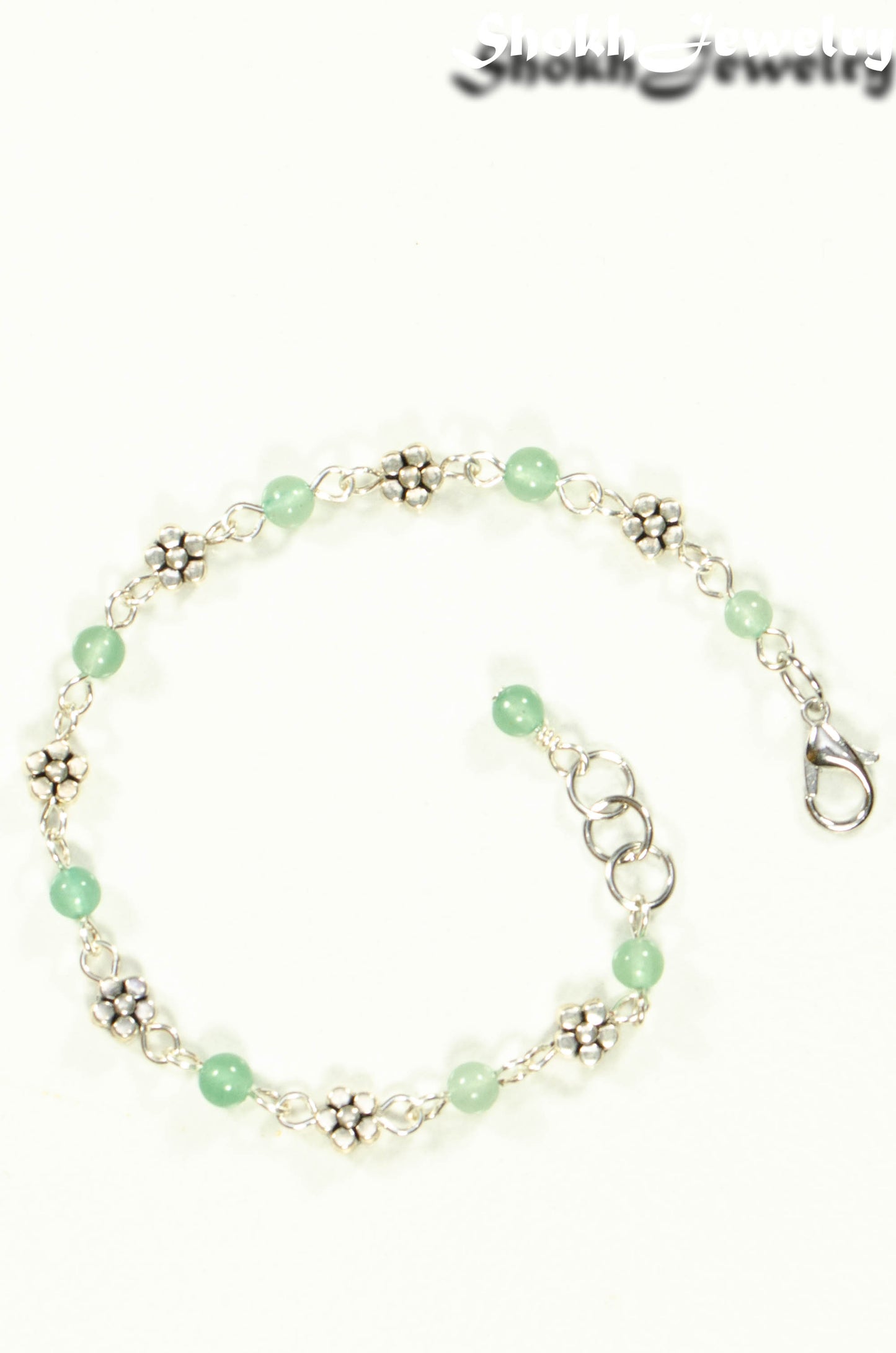 Top view of Tibetan Silver Flower and Green Aventurine Link Bracelet.