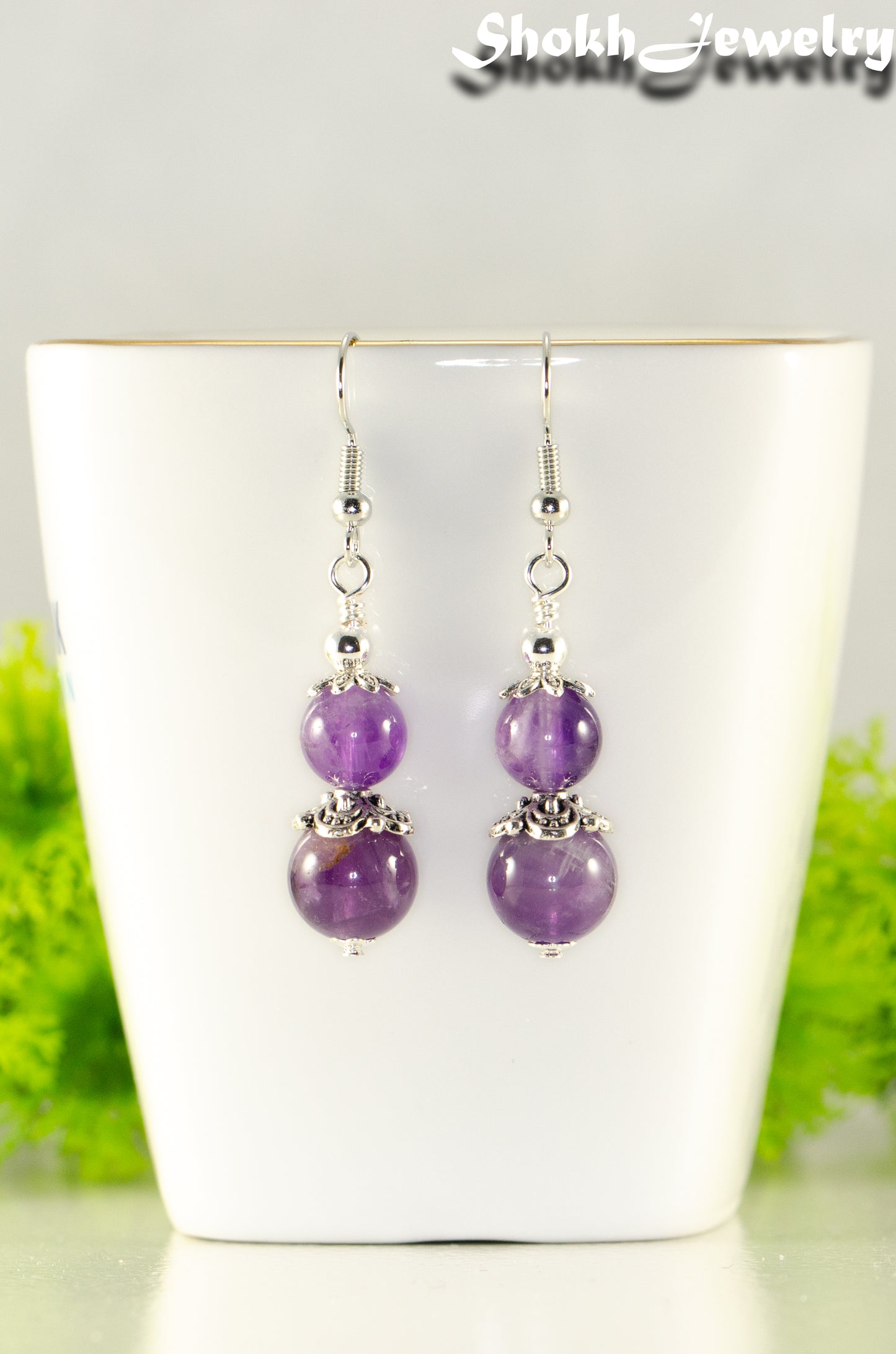 Close up of Natural Amethyst Dangle Earrings.
