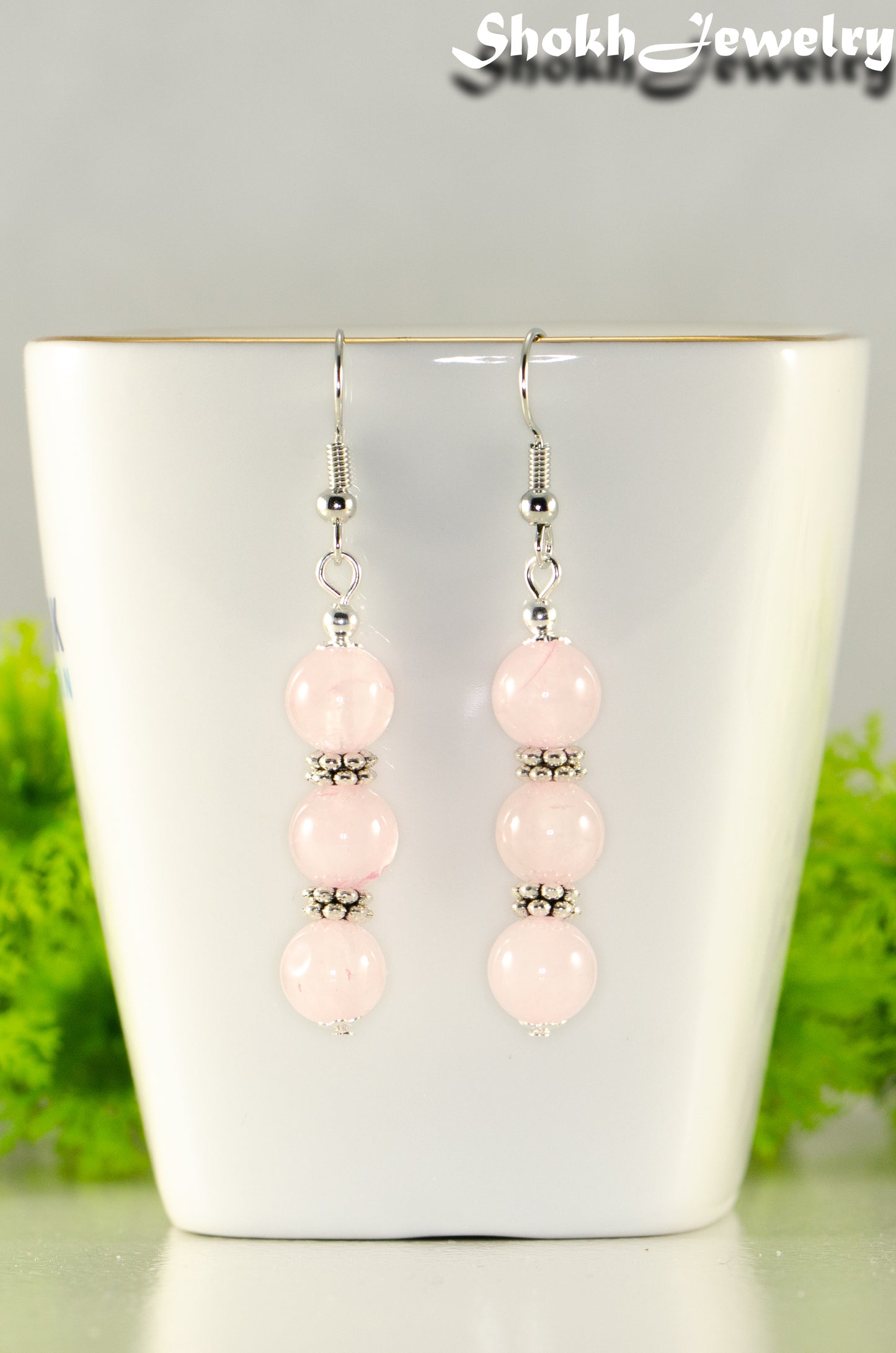 Close up of Natural Rose Quartz Beaded Bar Earrings.