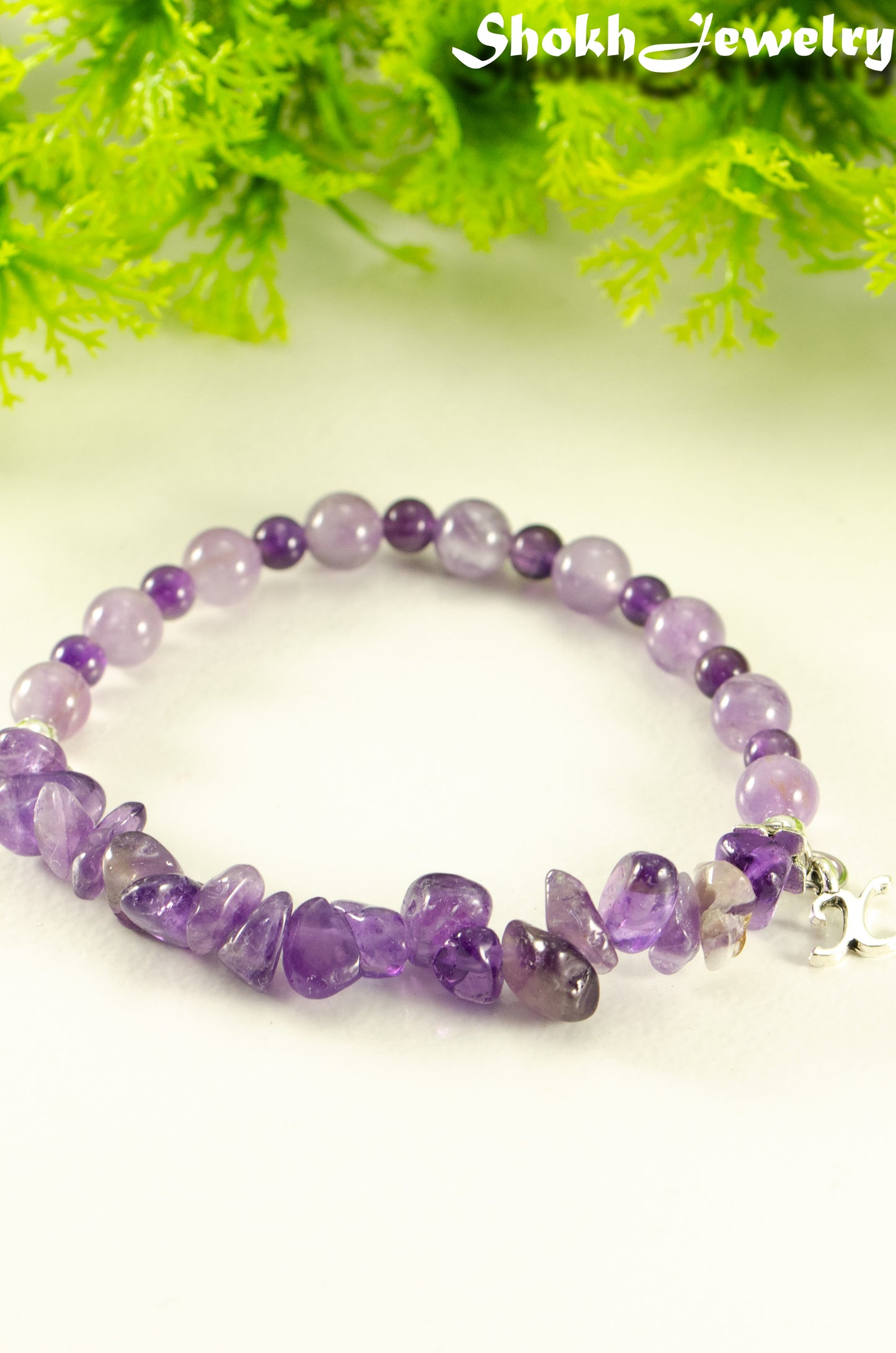 Close up of Amethyst Chip and Beads Bracelet with silver tone Initial