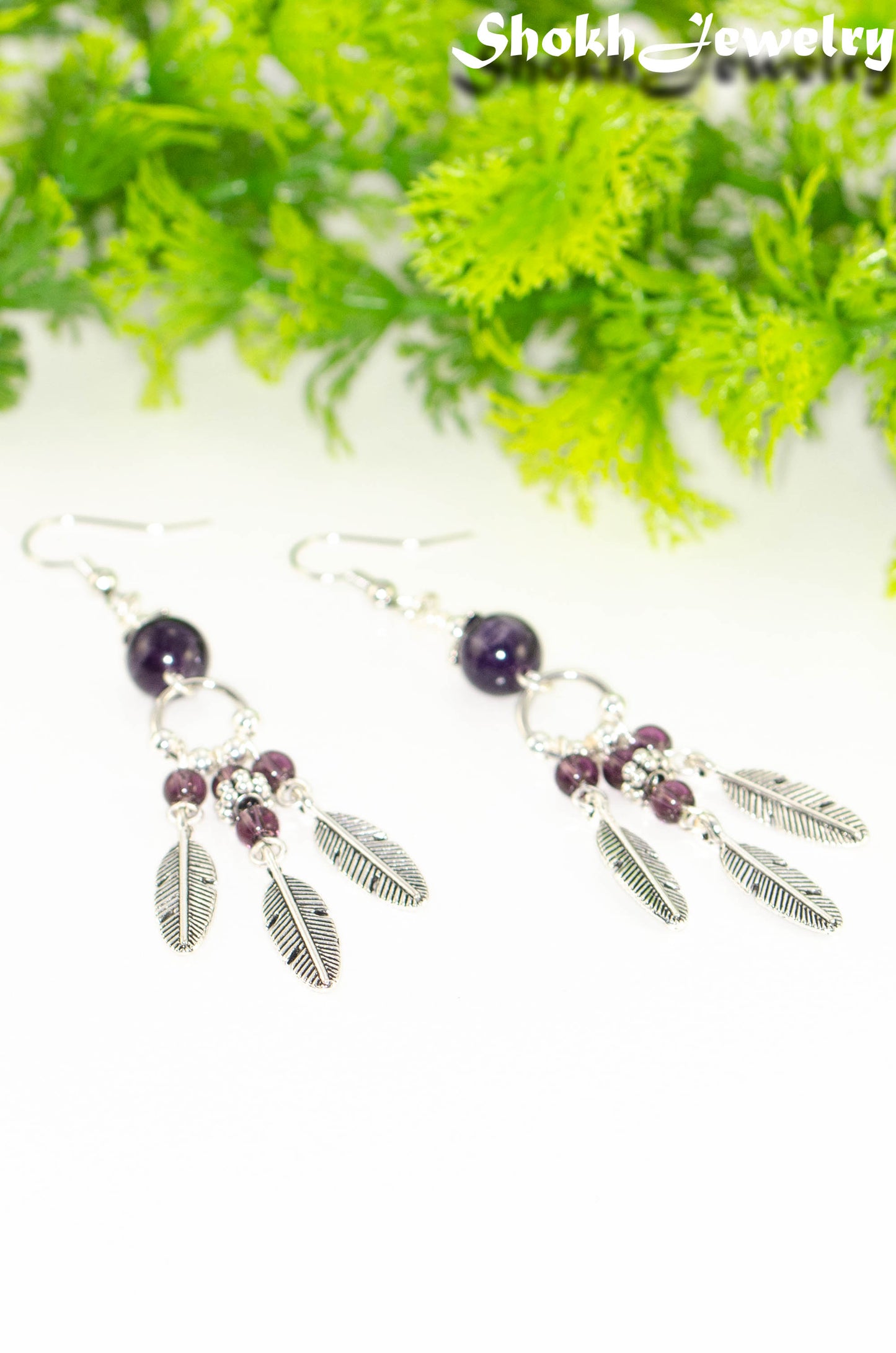 Statement Amethyst Crystal And Feather Earrings.