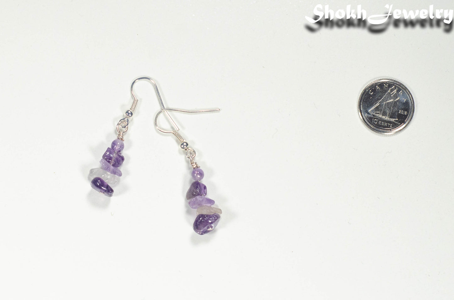 Natural Amethyst Crystal Chip Earrings beside a dime
